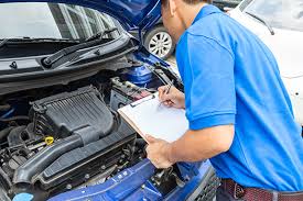 mechanic inspecting a car